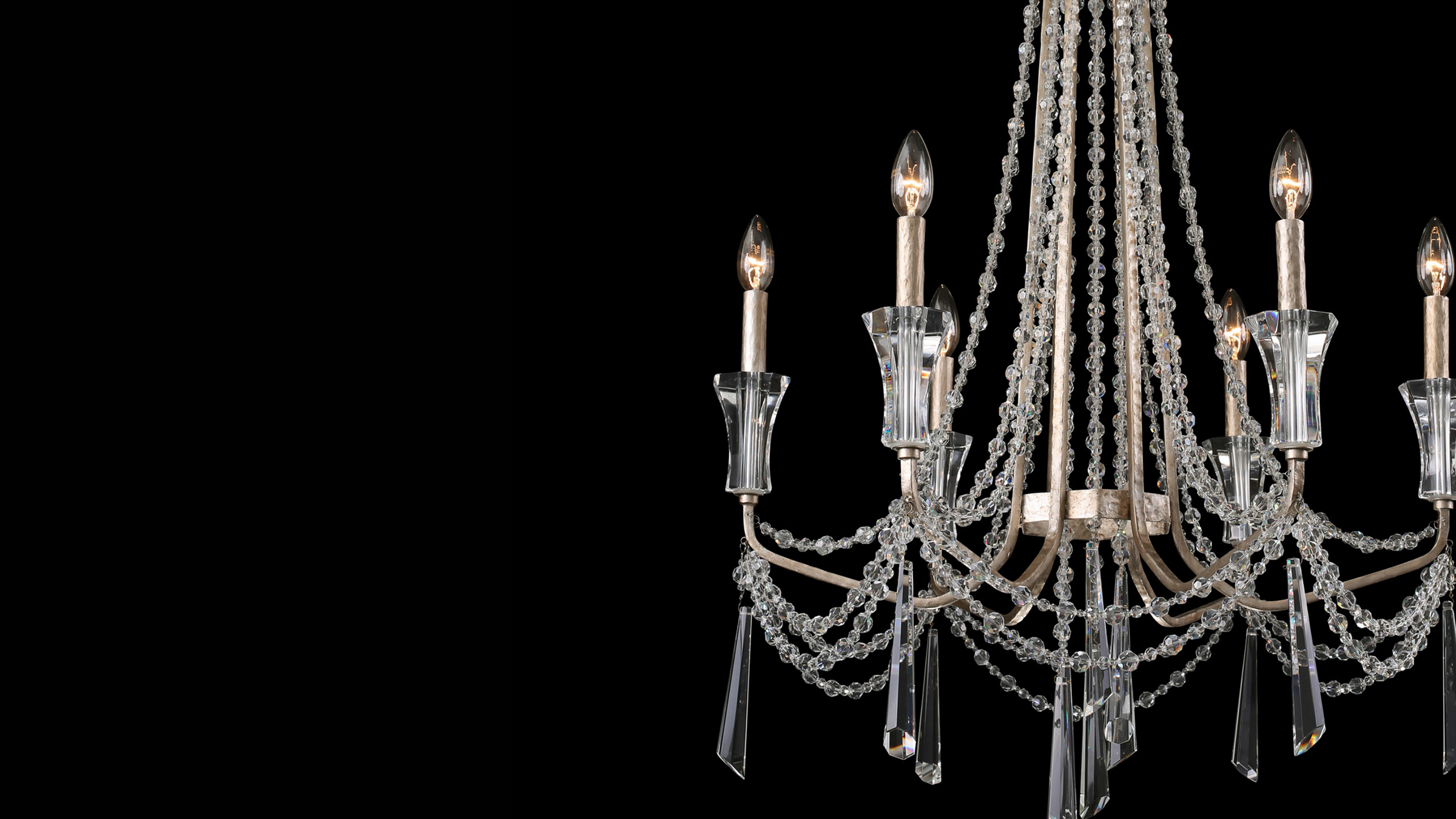 Barcelona chandelier up close image showing crystal detail against black background