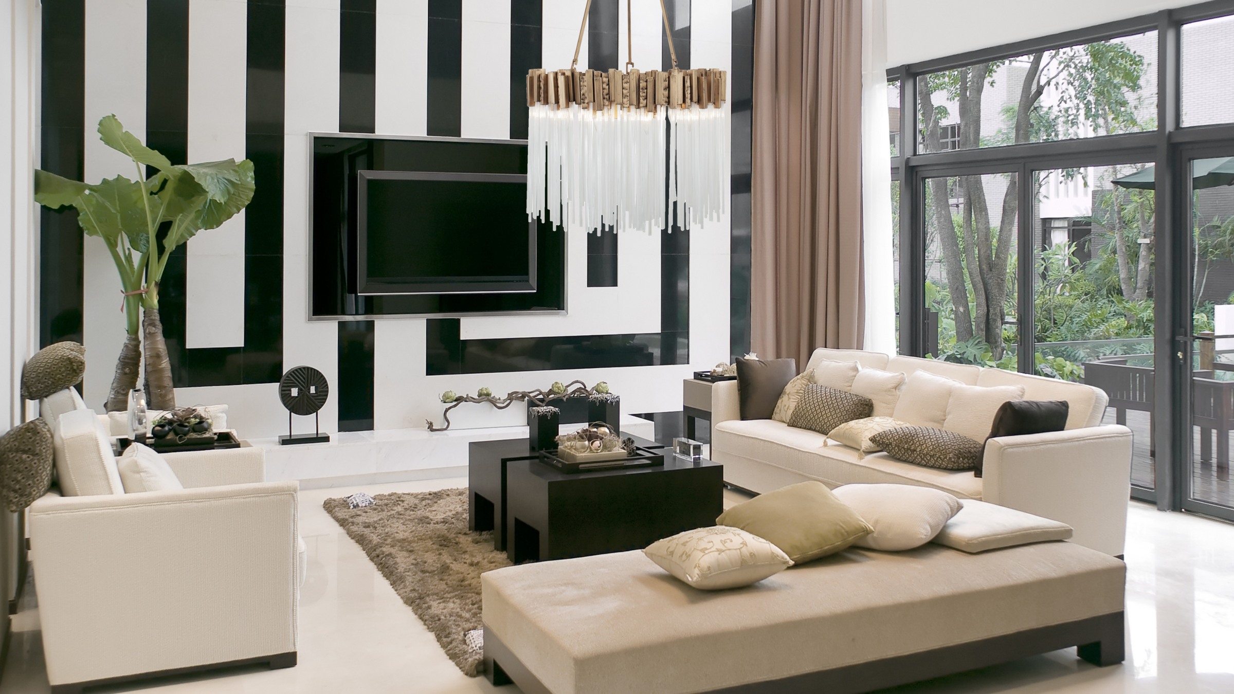 Matrix pendant shown in large living room with a black and white statement wall