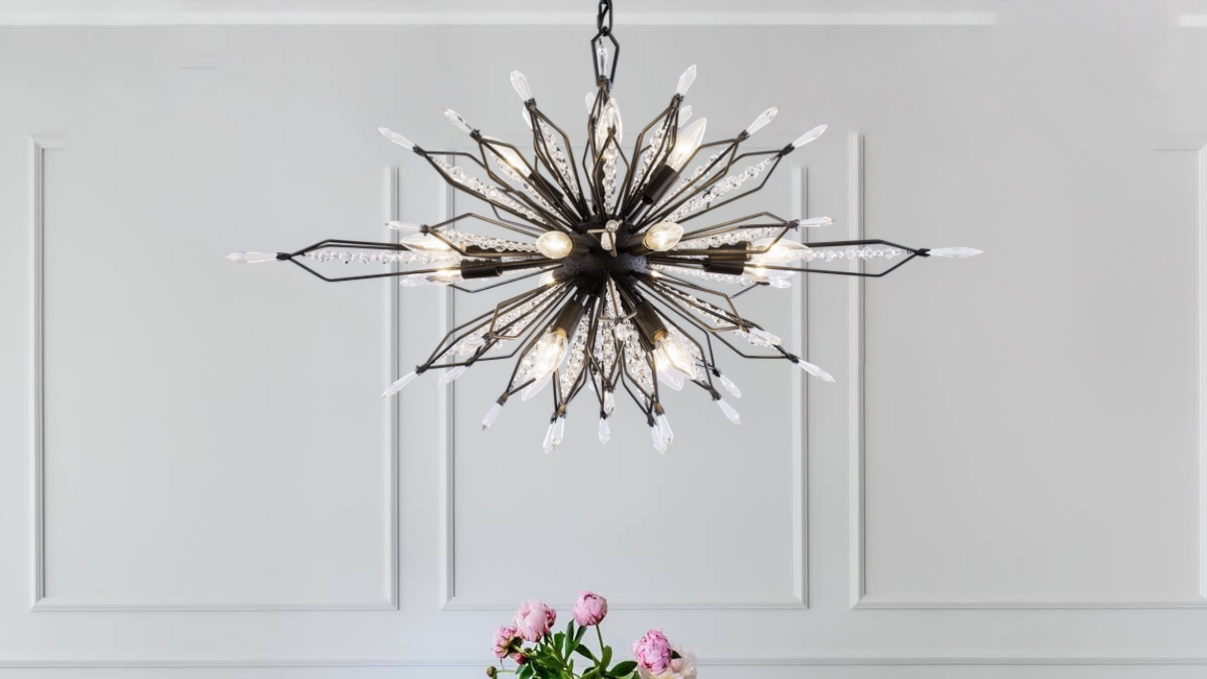 Orbital crystal sputnik light fixture in an ivory paneled room