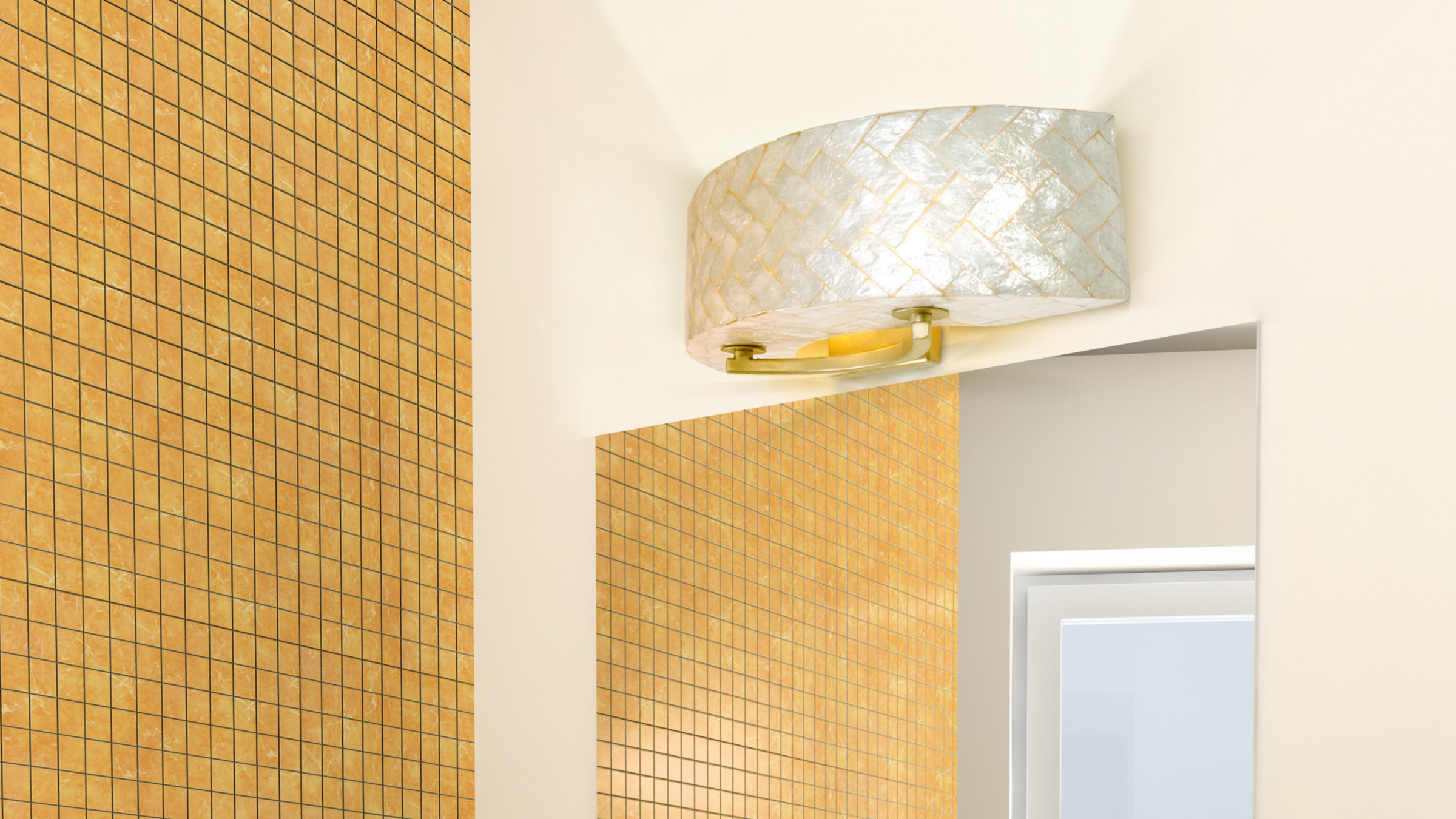 Radius Shell bath fixture shown hunt over mirror next to a yellow tile wall